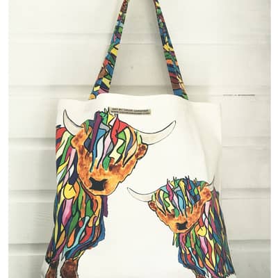 Chloe infront of some feather pictures and her famous crackers