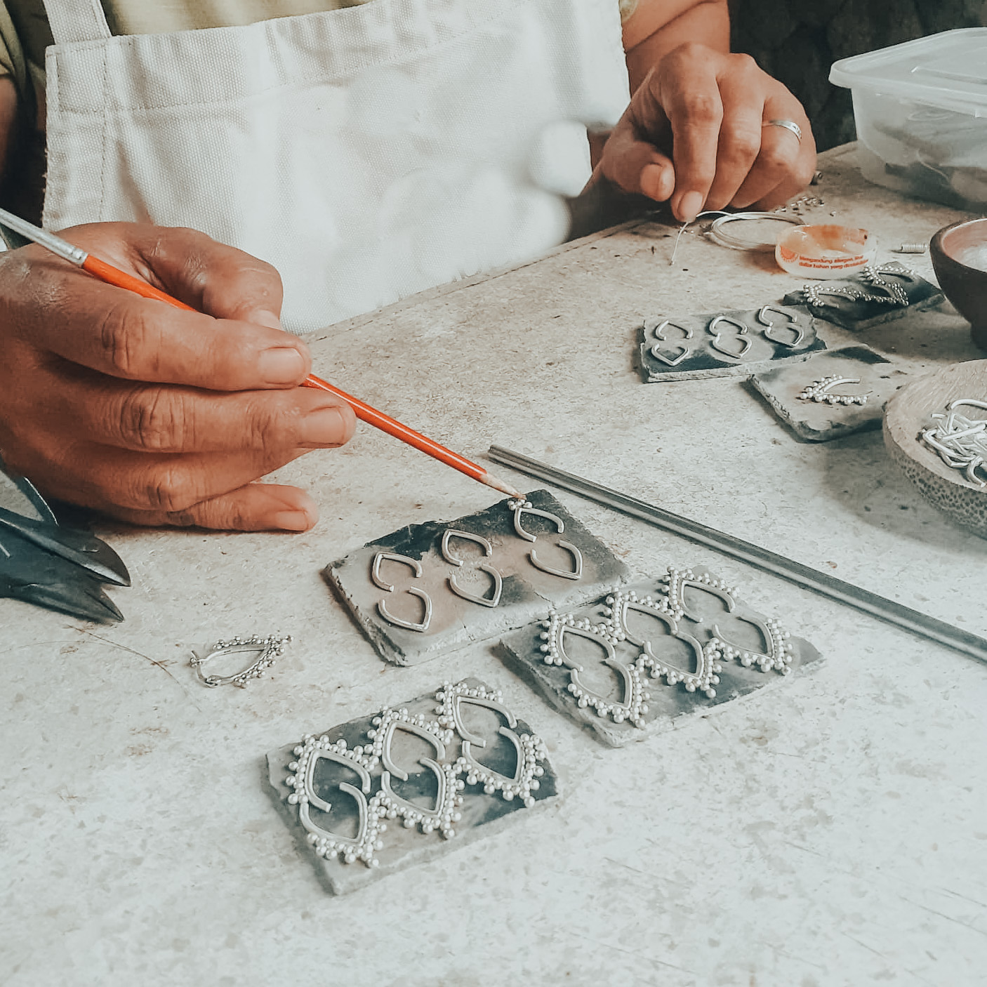 Silversmith making jewellery