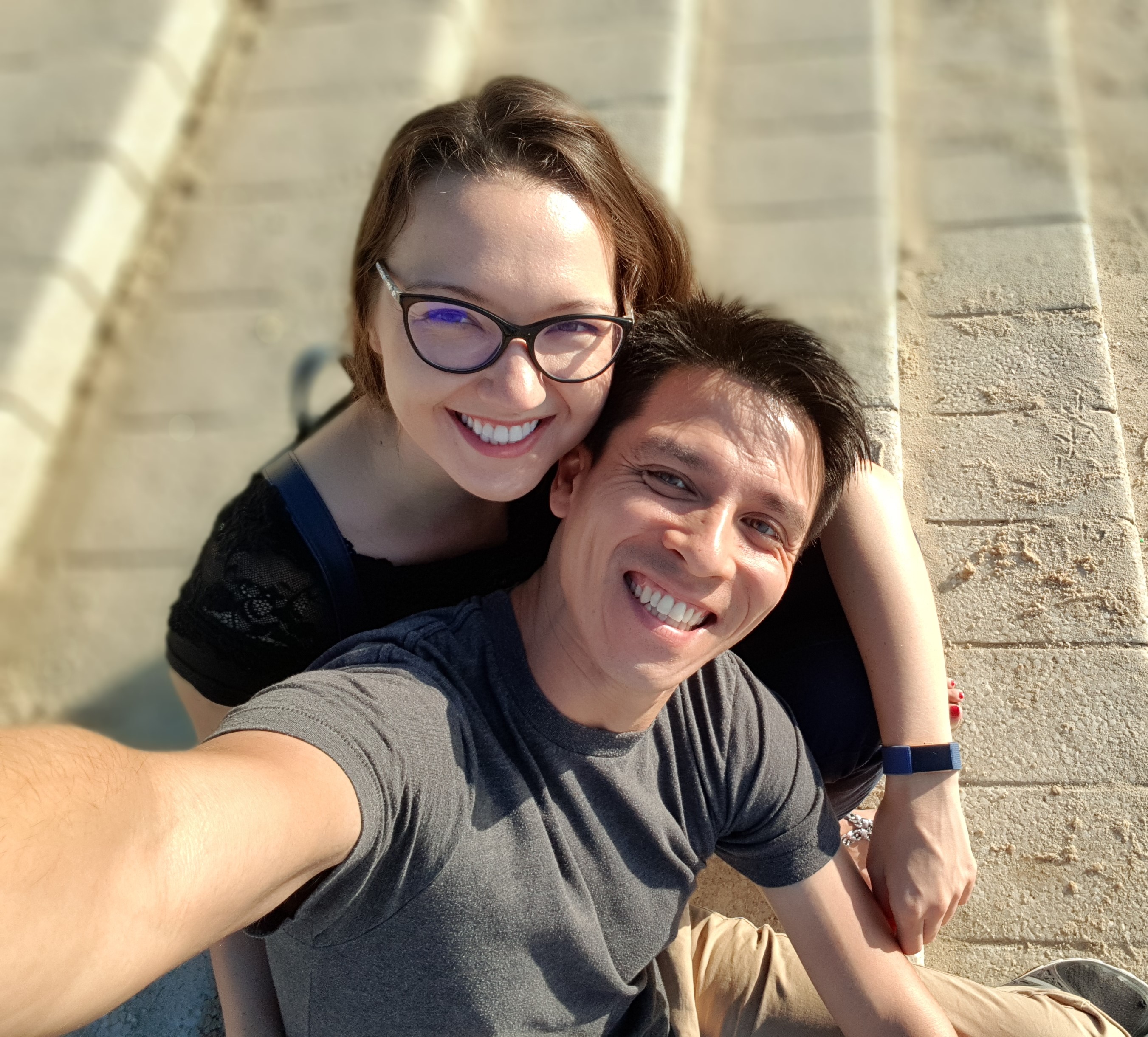 Founders of PiQi, 2 people sitting on the steps