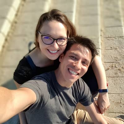 Founders of PiQi, 2 people sitting on the steps