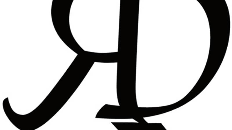 The "RD House of Chocolate" logo is set against a clean white backdrop. The brand name is elegantly scripted in black, adding a touch of contrast.