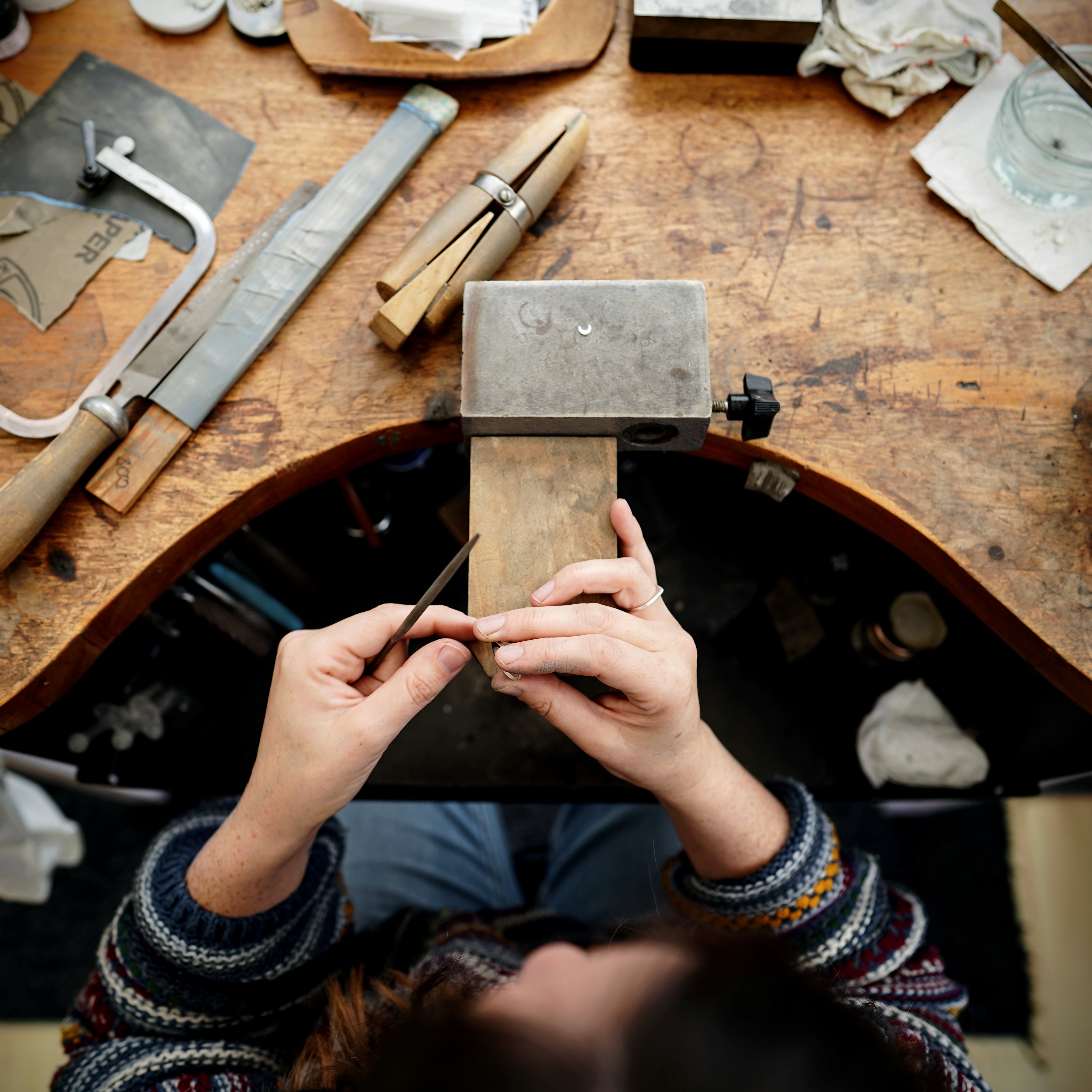 Arial view of kate working at the bench