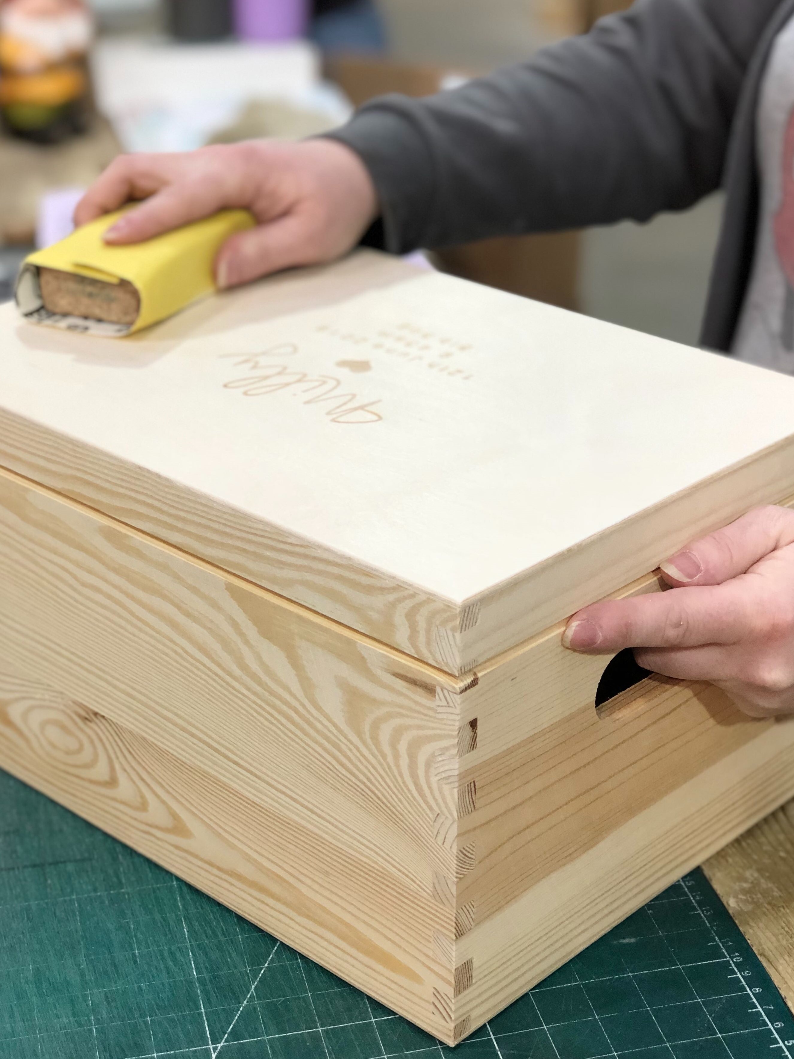 Handmade leather and beech wood keyring in production