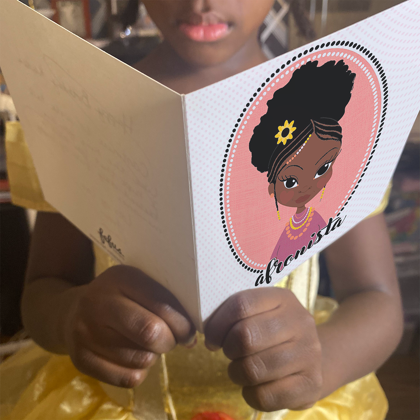 little black boy looking at empowering art