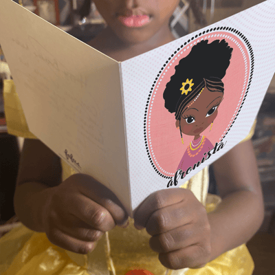 little black boy looking at empowering art