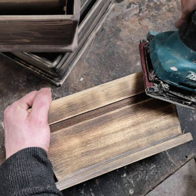 Planter being sanded