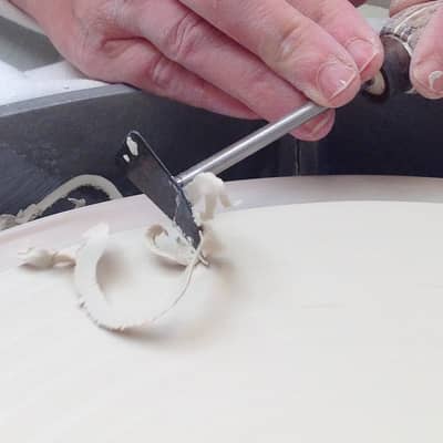Turning a porcelain plate