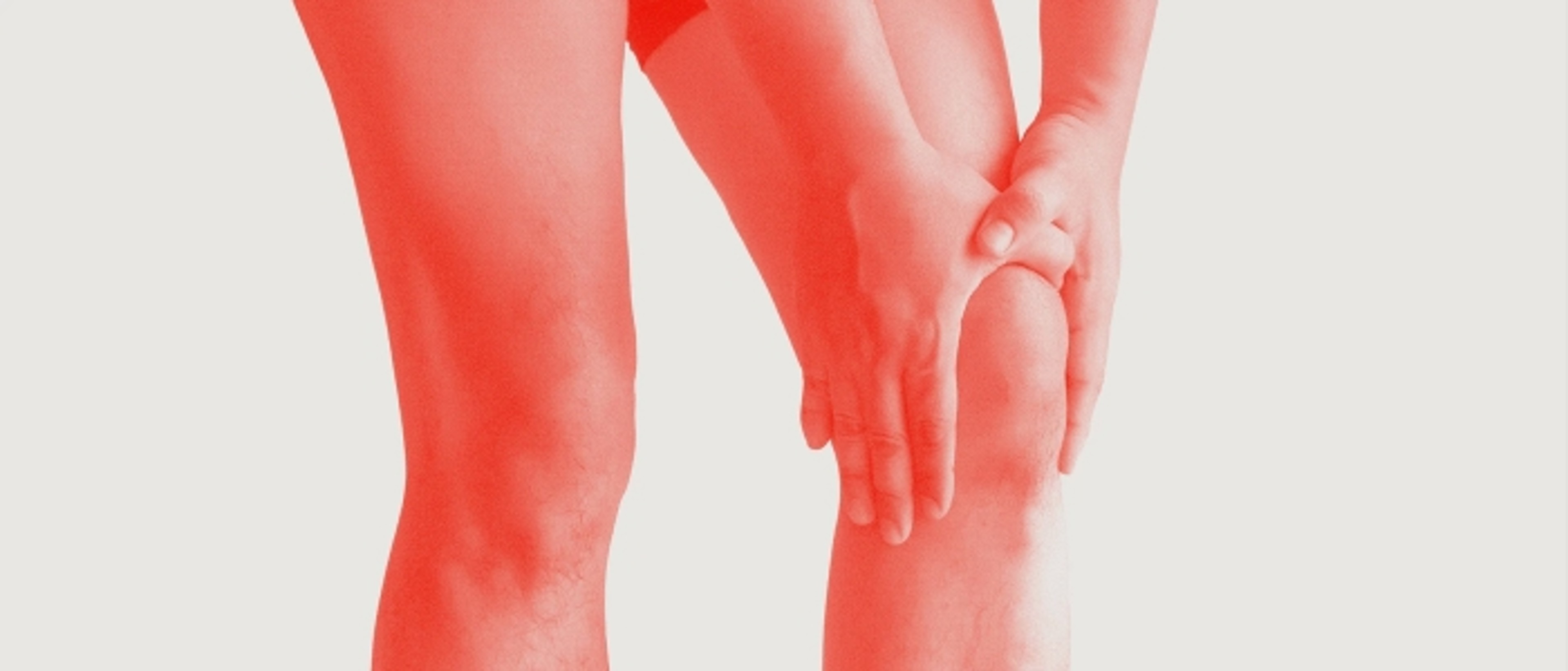 Illustration of a person holding a painful knee