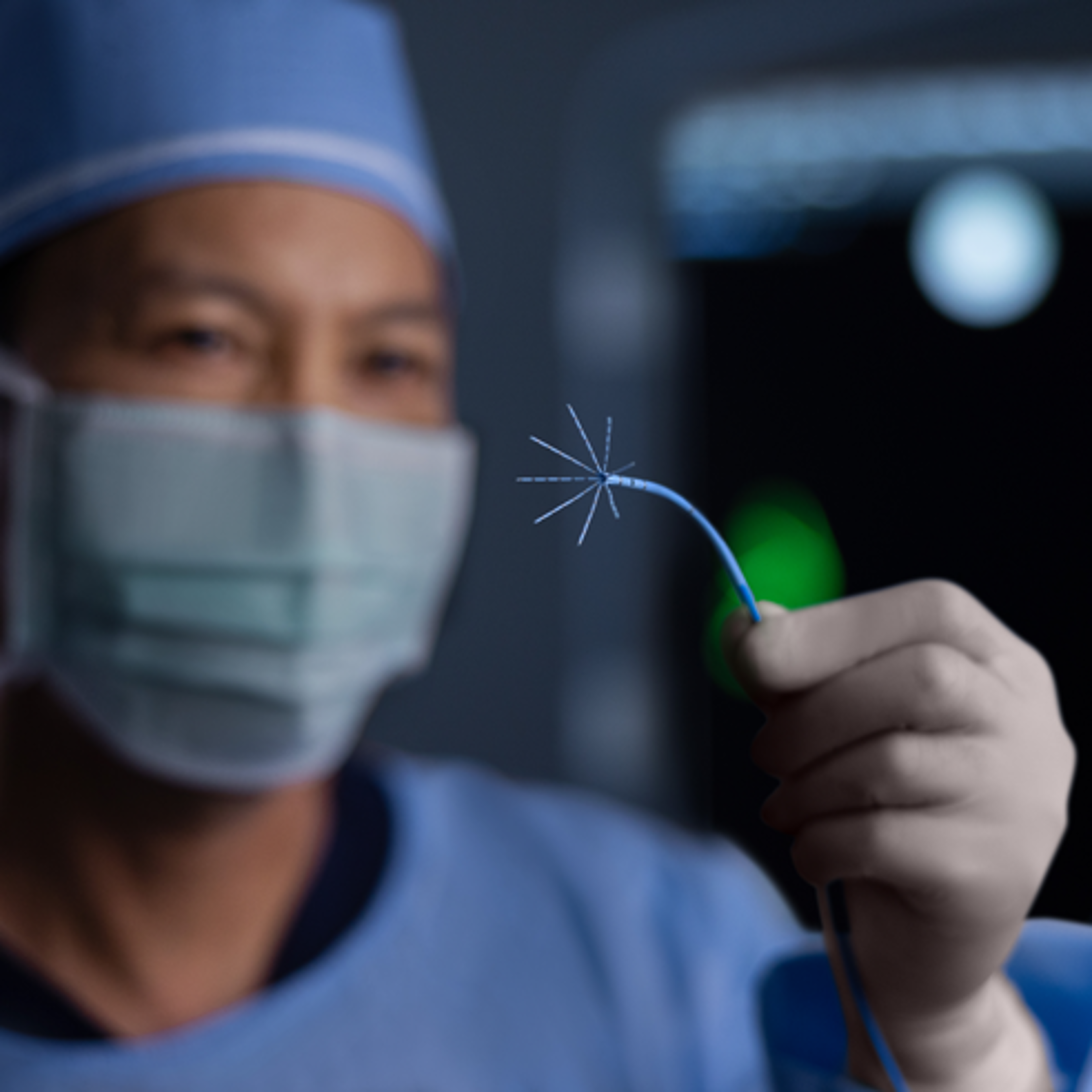 Physician holding OCTARAY™ Mapping Catheter.