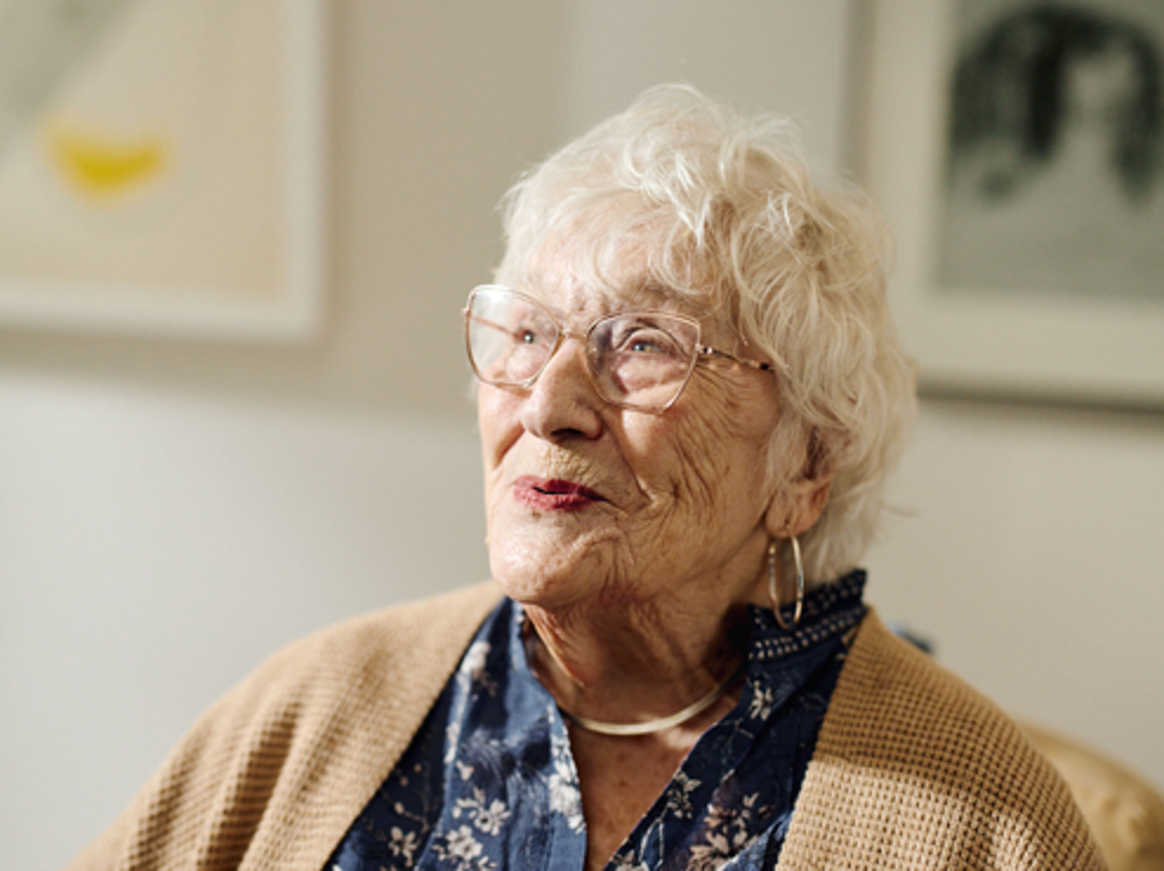 Older woman looking up in positive way.