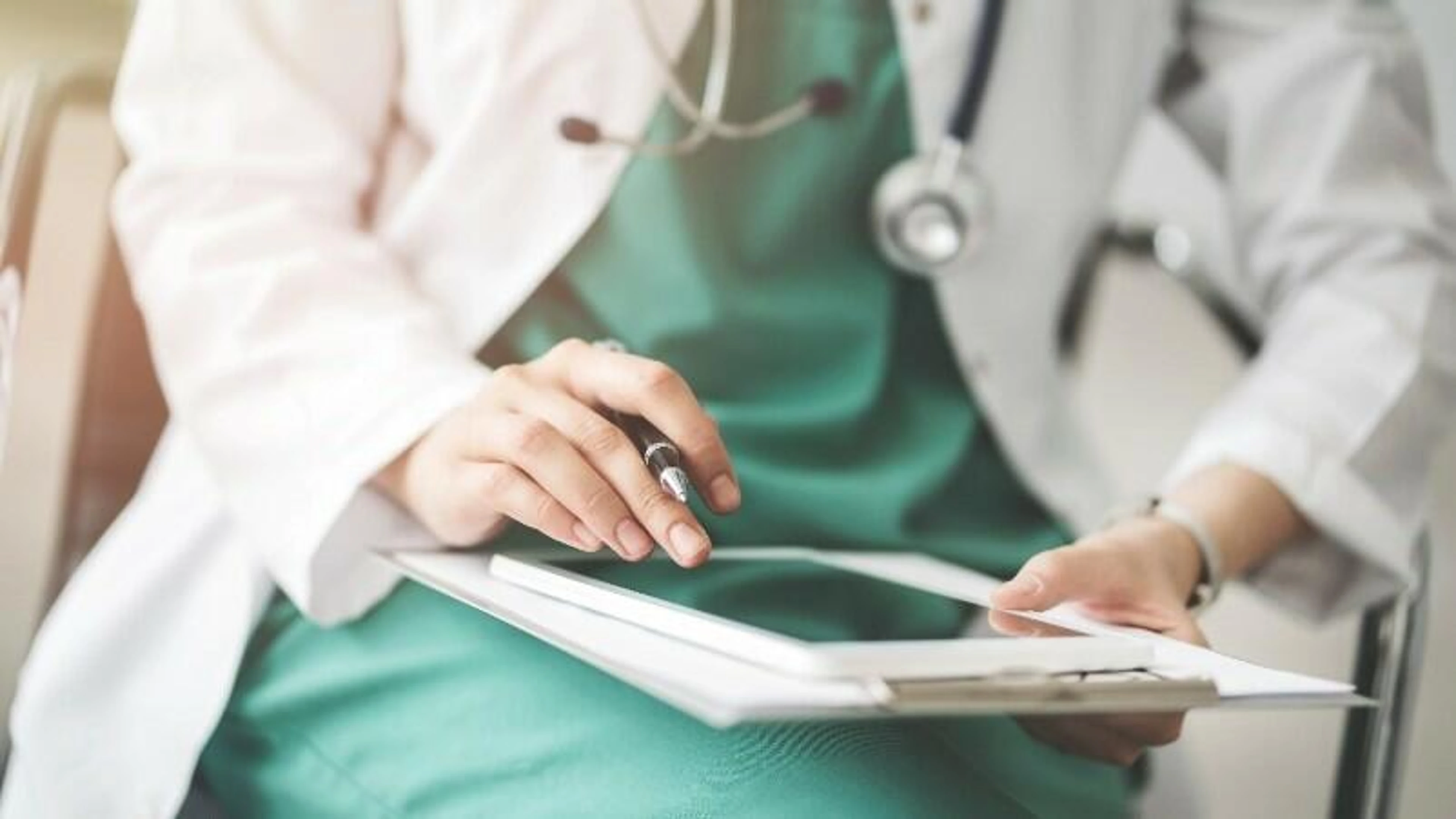 Illustration of physician with tablet