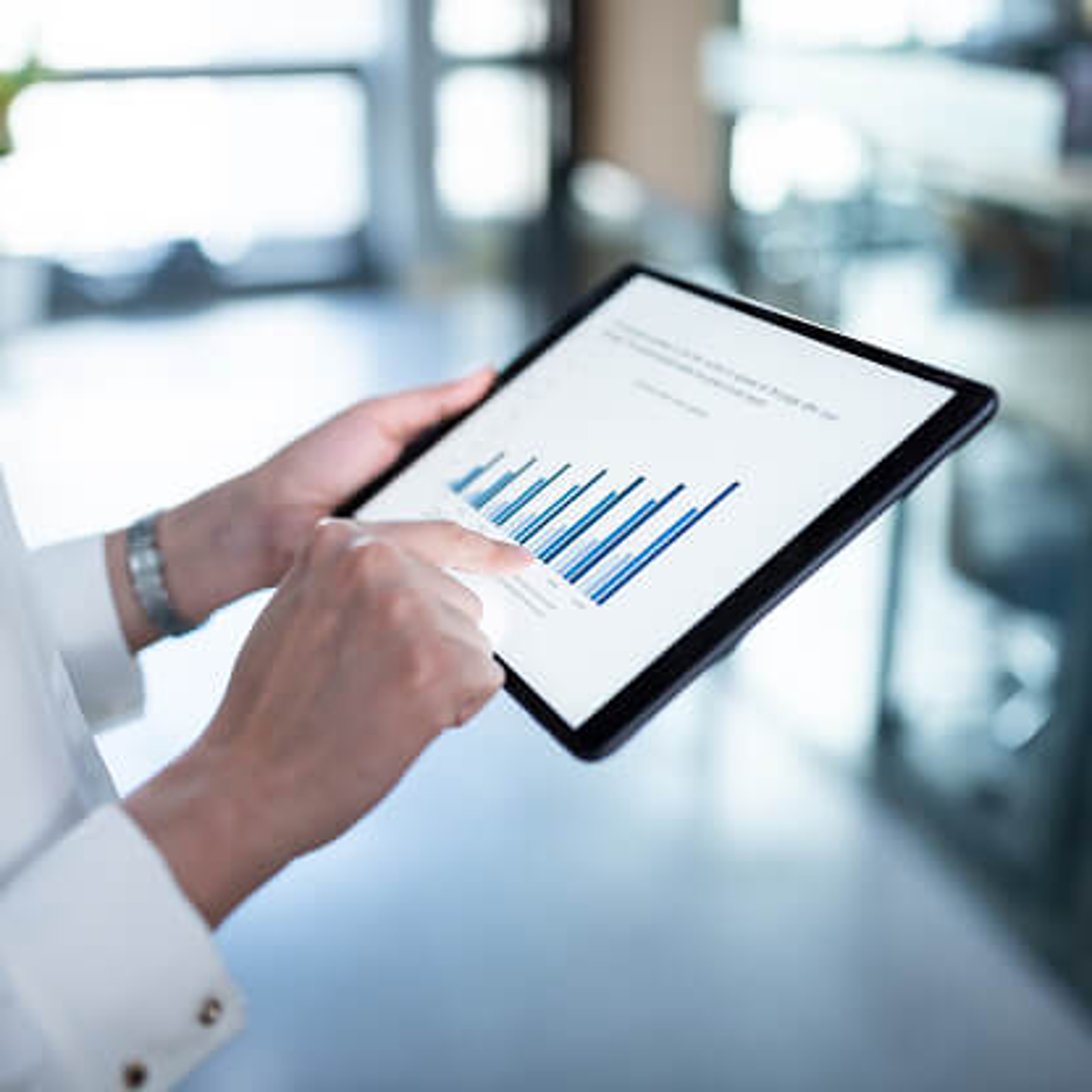 person on tablet with stats