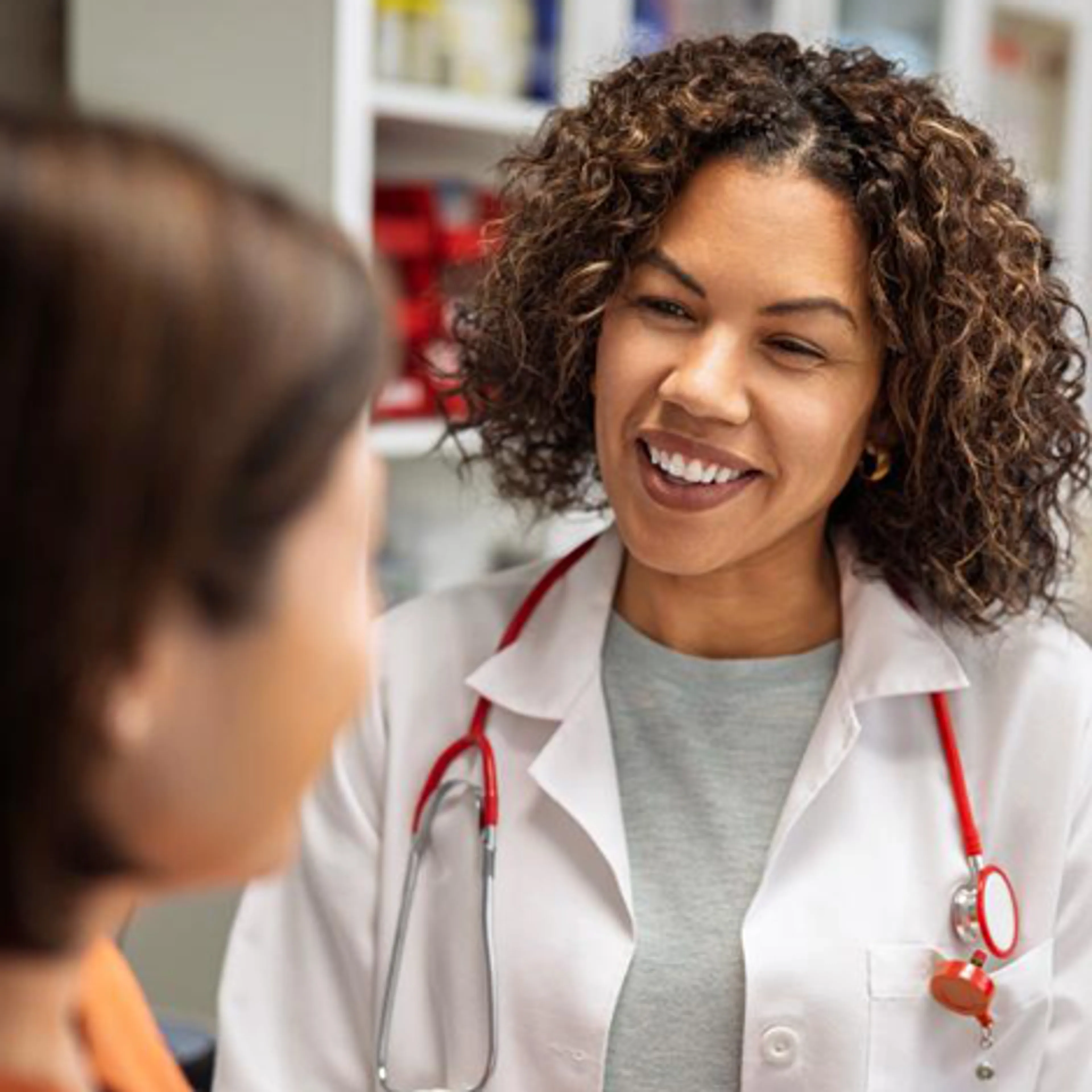 Physician smiling at her patient.