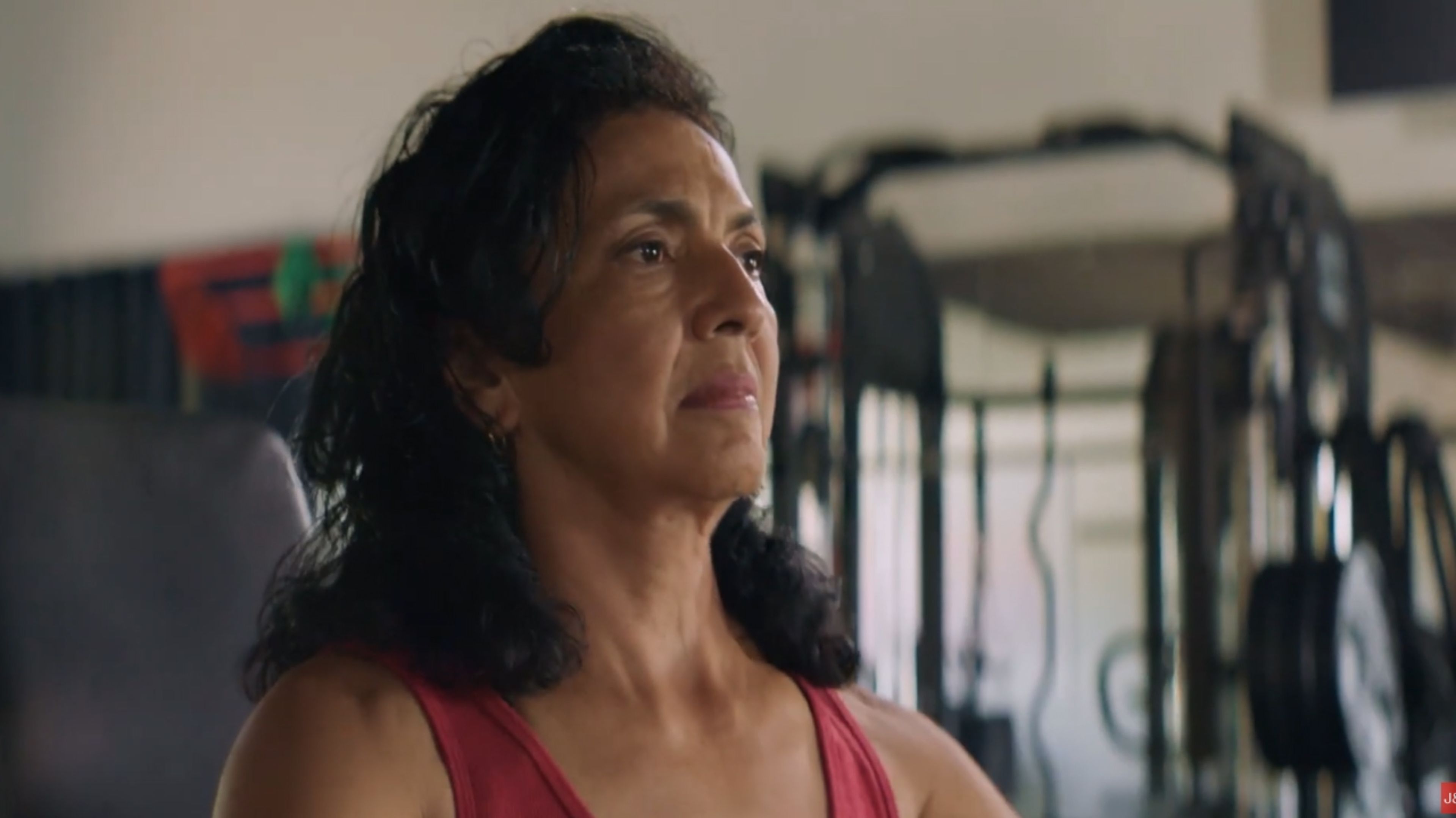Woman in workout clothing at a gym