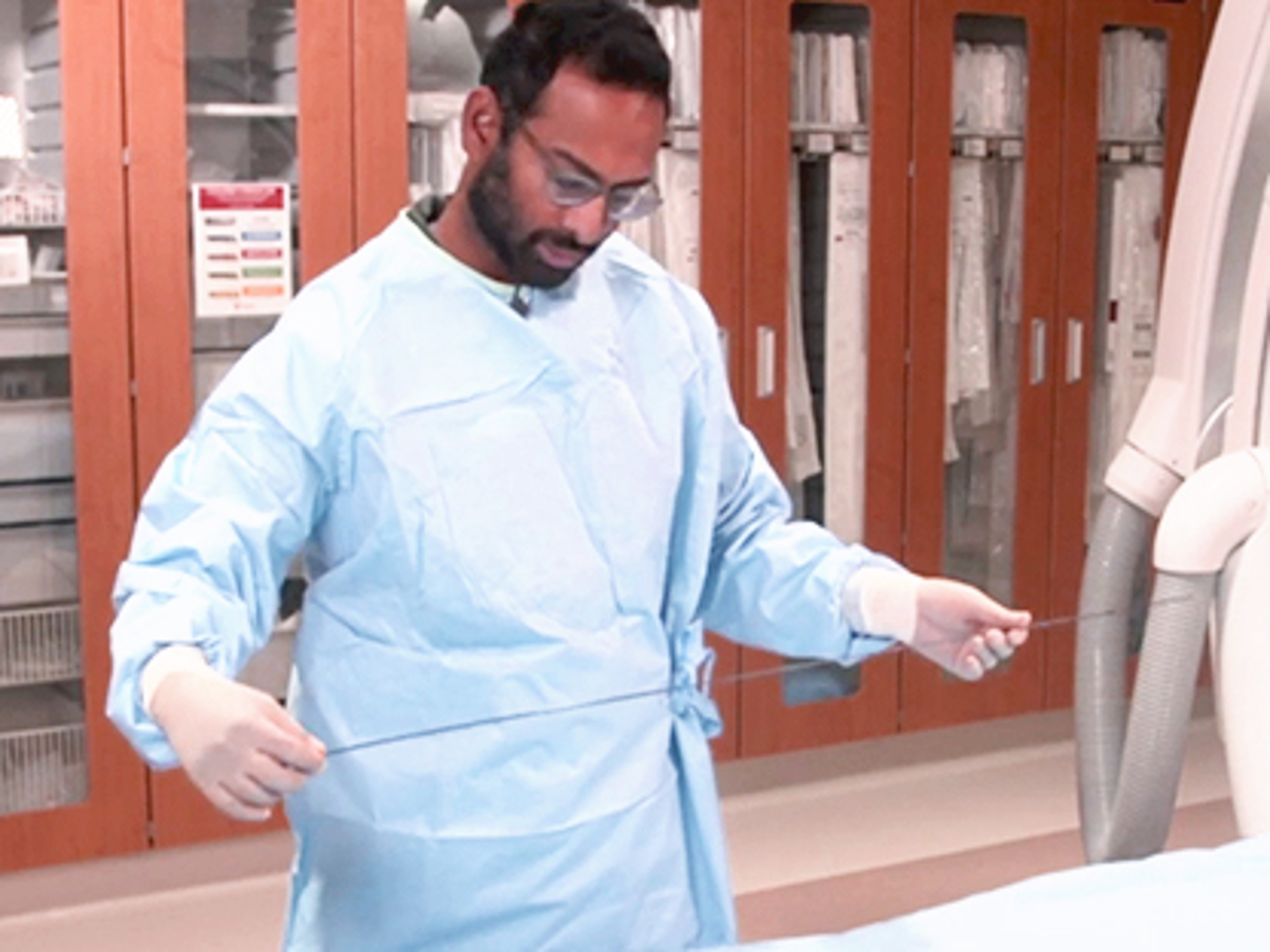Illustration of physcian prepping EMBOGUARD™ Balloon Guide Catheter