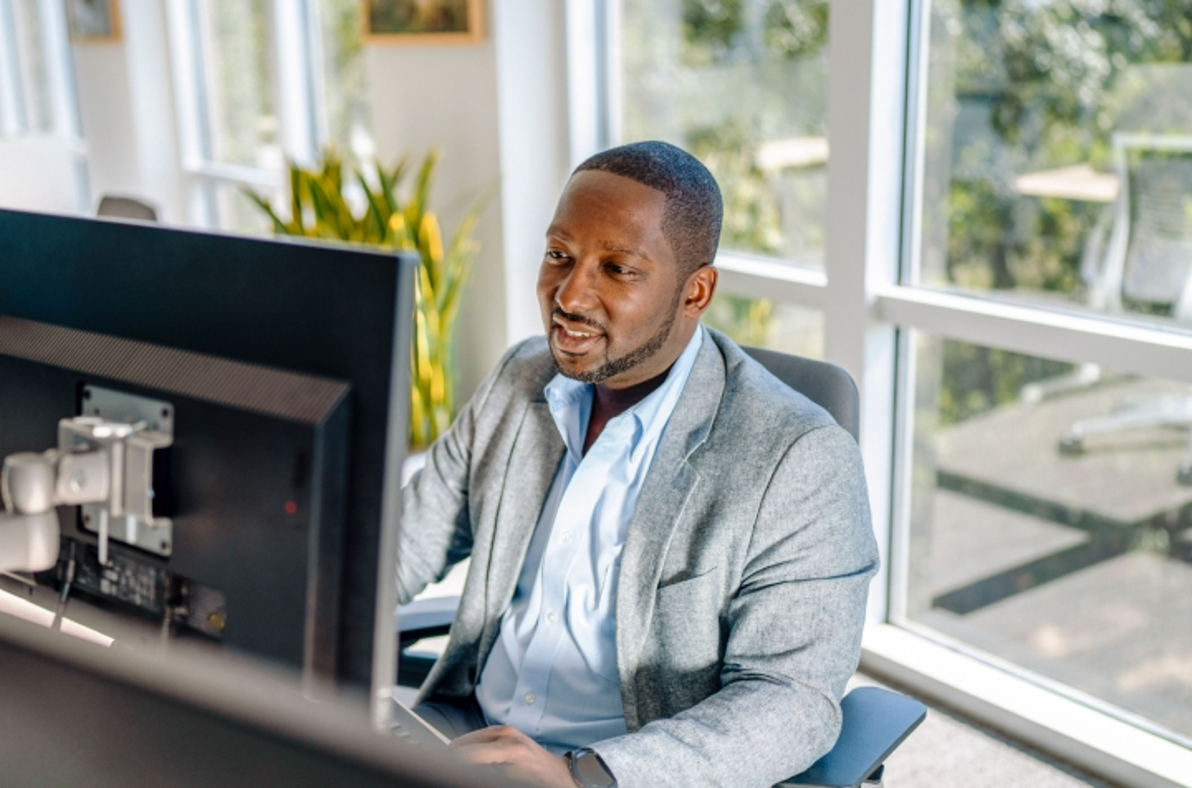 Healthcare professional working at a computer