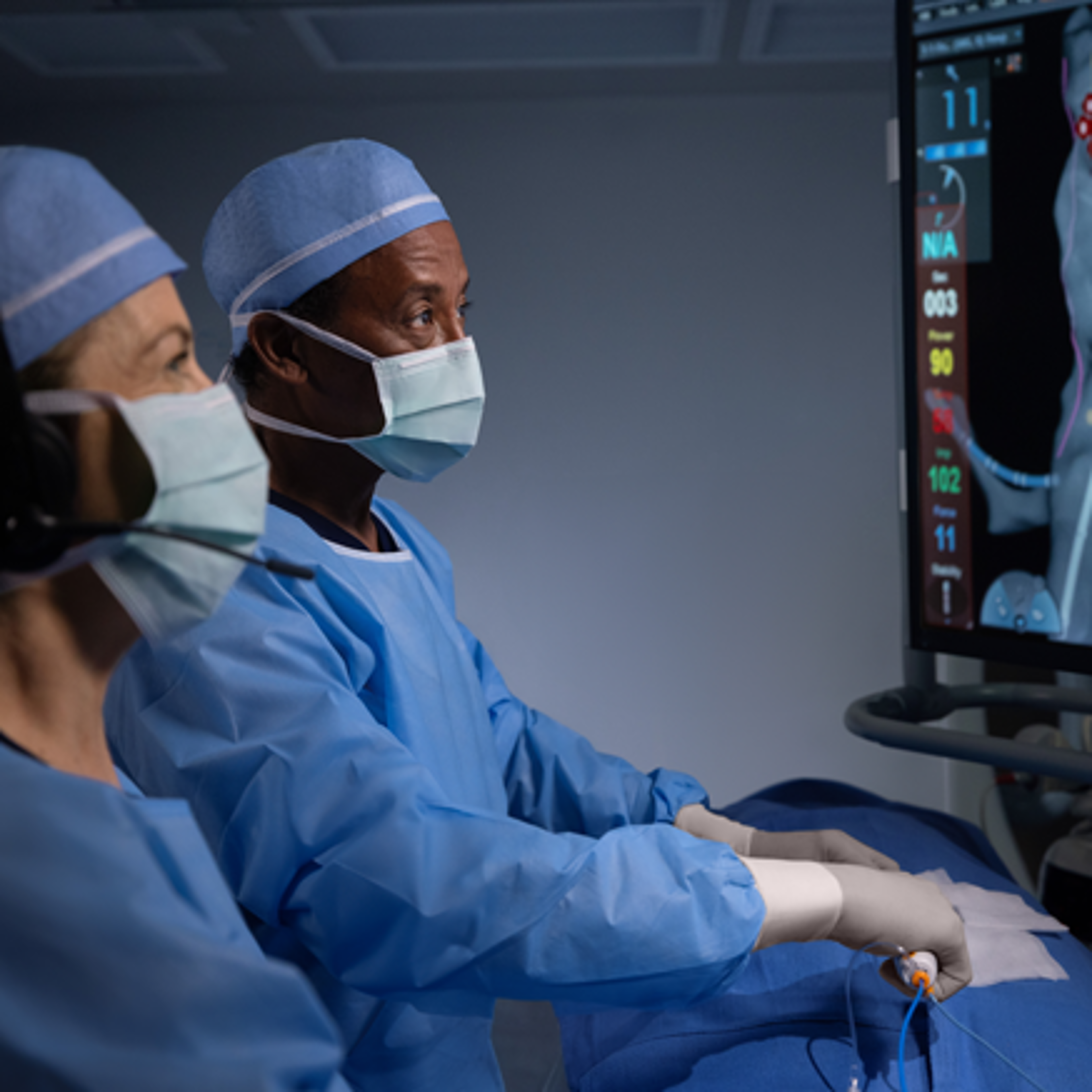 Electrophysiologist using the SOUNDSTAR™ Ultrasound Catheter to view left atrial anatomy on the monitor while consulting with an Ultrasound Clinical Account Specialist.