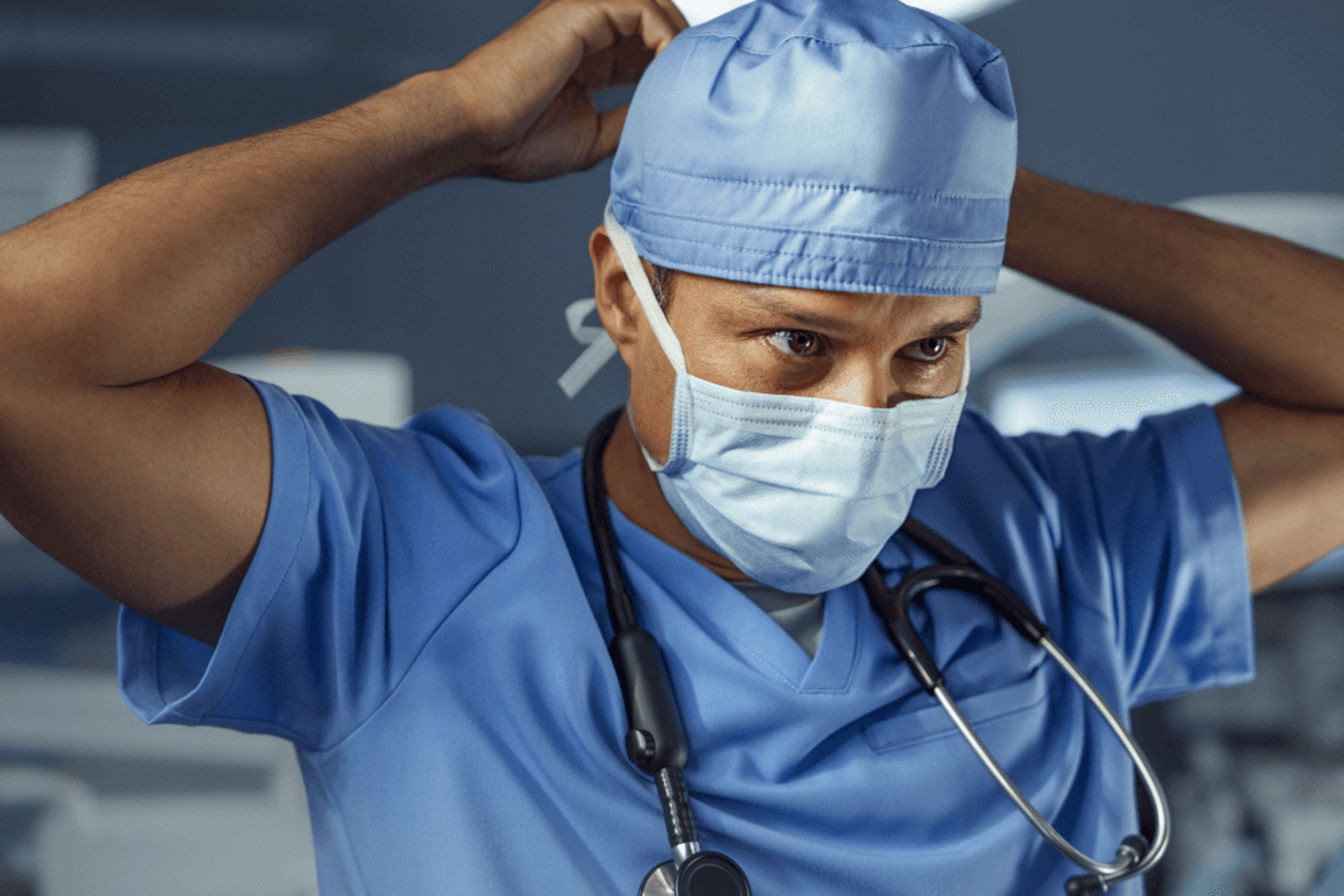 Surgeon putting on a surgical cap in preparation for surgery.