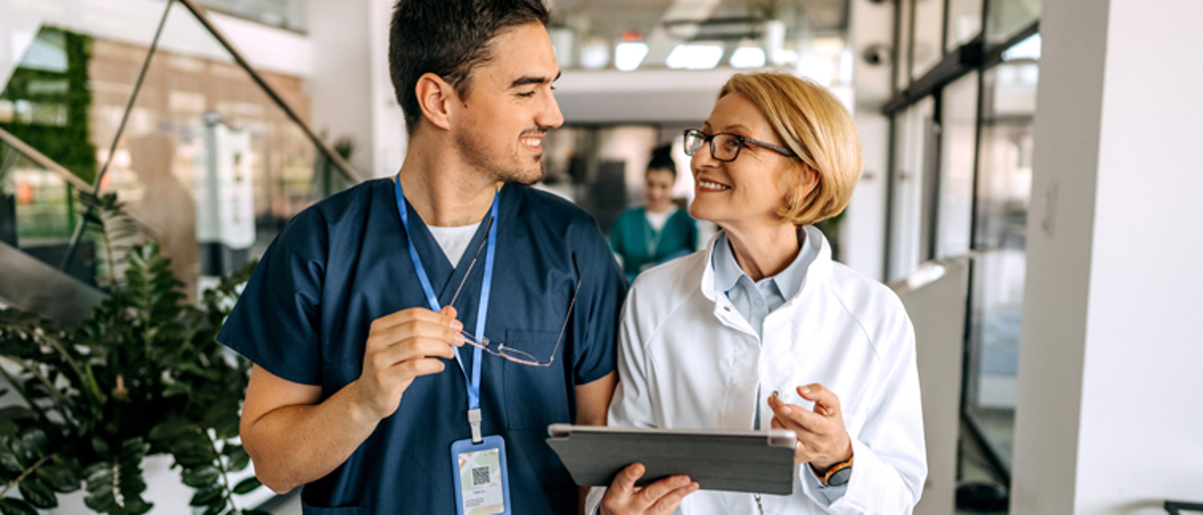 Physician and Therapy Advancement partner walking together.
