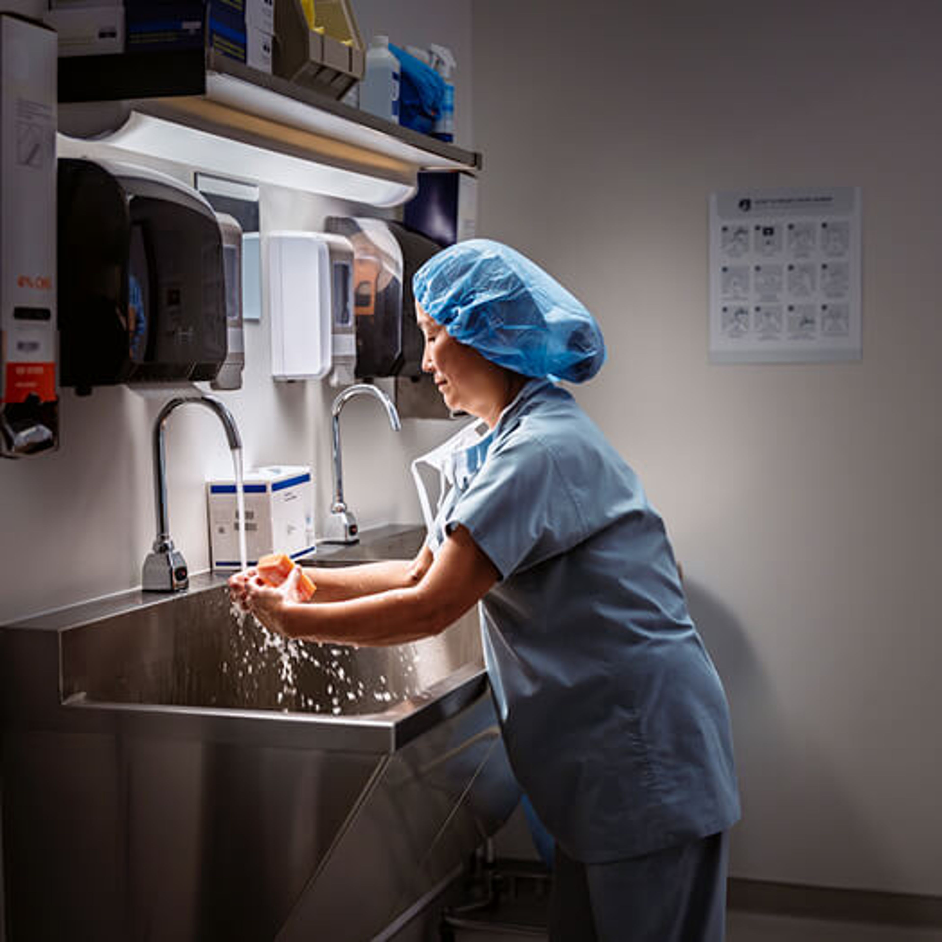 Surgeon washing her hands