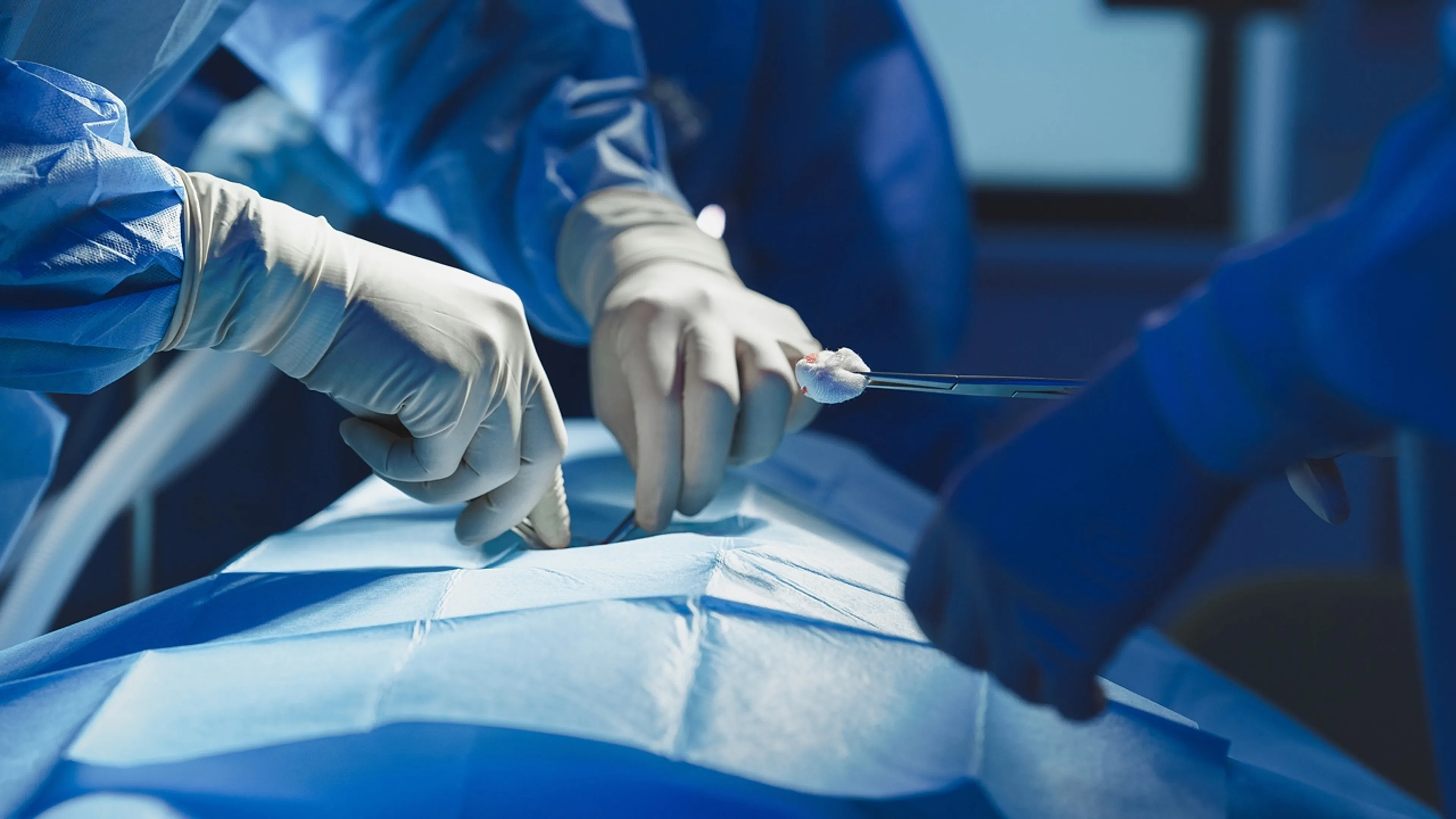 Surgeons working with a patient