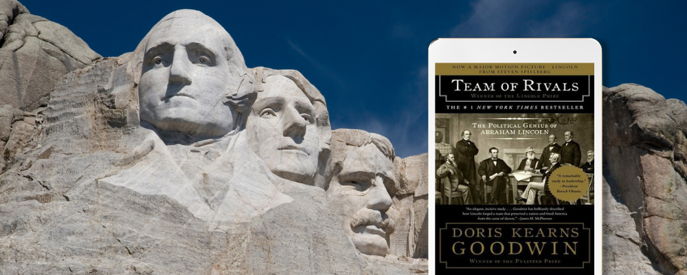 Mount Rushmore National Memorial with an iPad featuring the title "Team of Rivals"