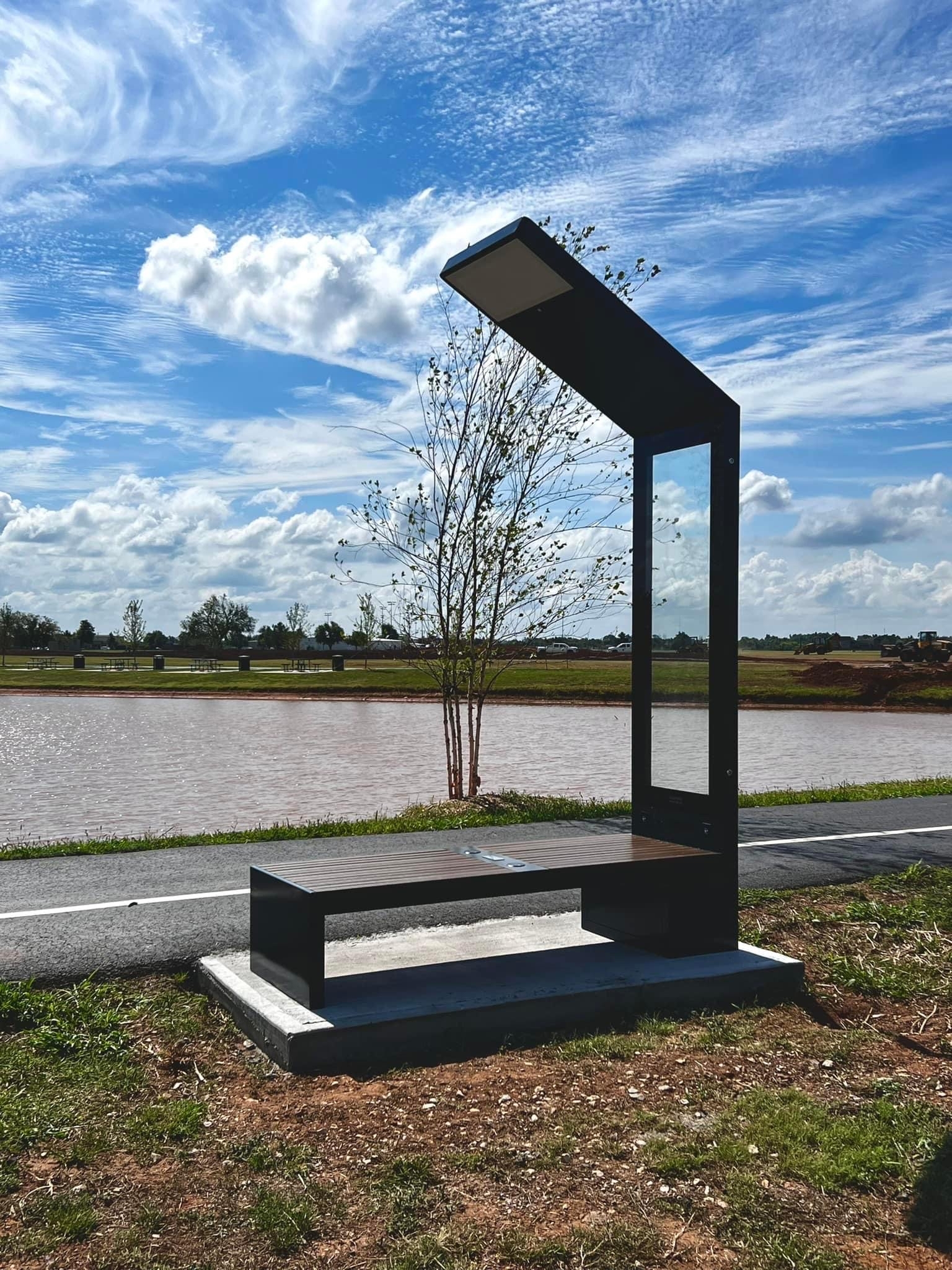 Pioneer Library System bench by the lake