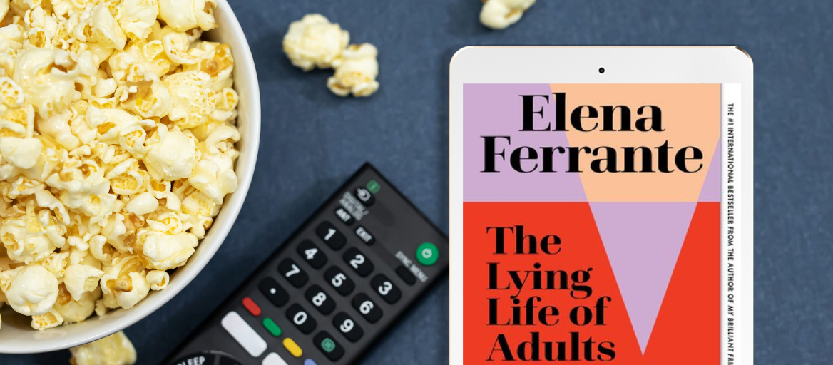 A bowl of popcorn, a TV remote and an iPad featuring the ebook "The Lying Life of Adults" by Elena Ferrante