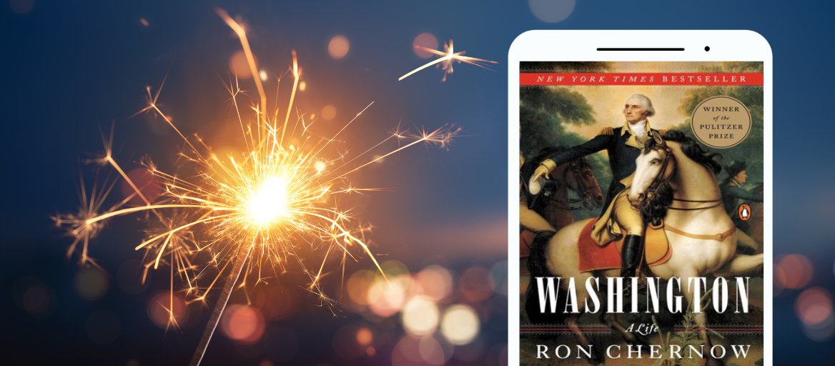 Photo of a sparkler with a tablet featuring the cover of the book "Washington: A Life"