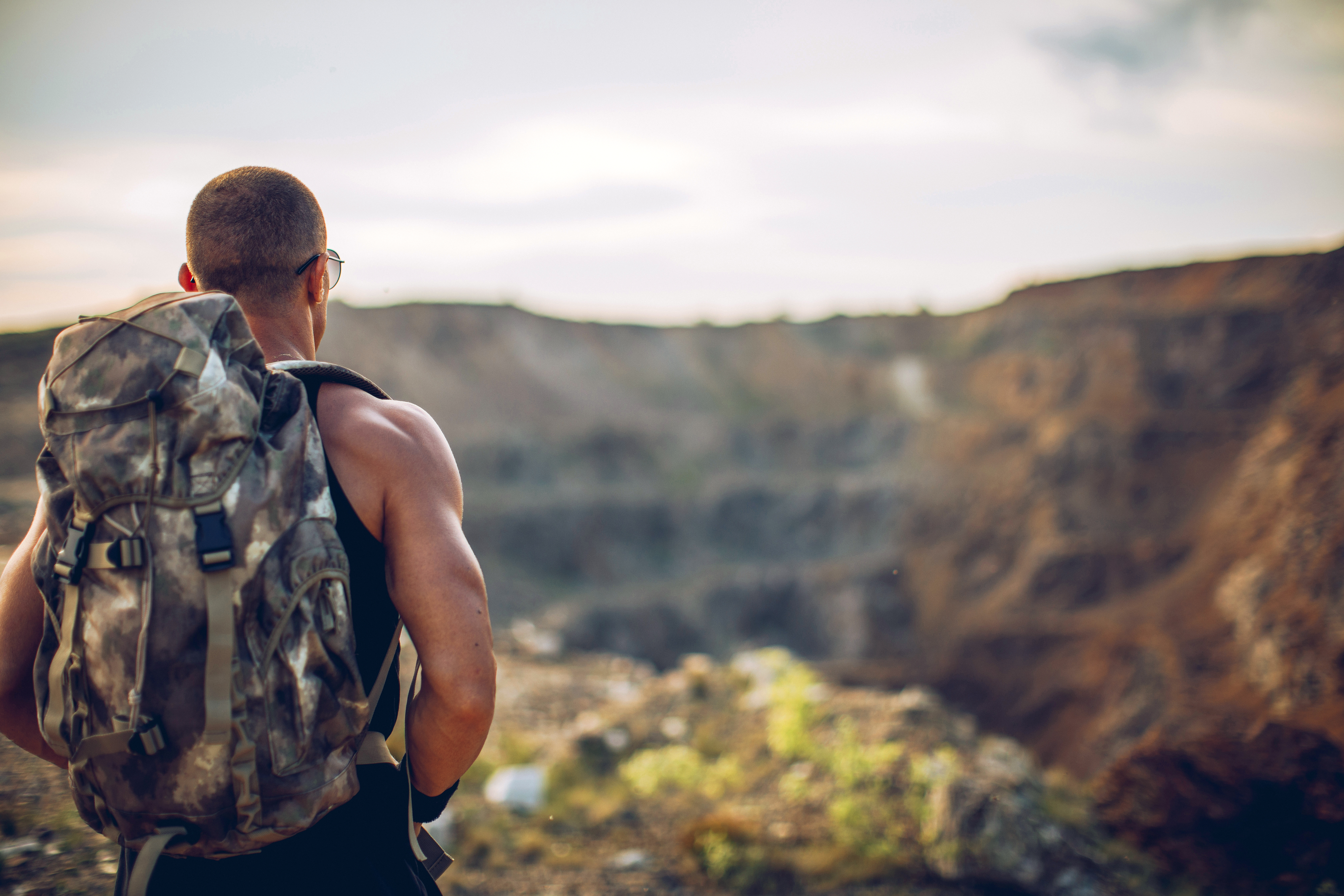 Man walking alone on a trail in the United States.