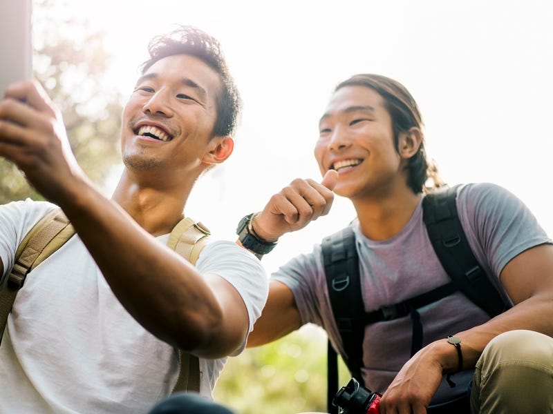 Two friends making a video call outdoors.