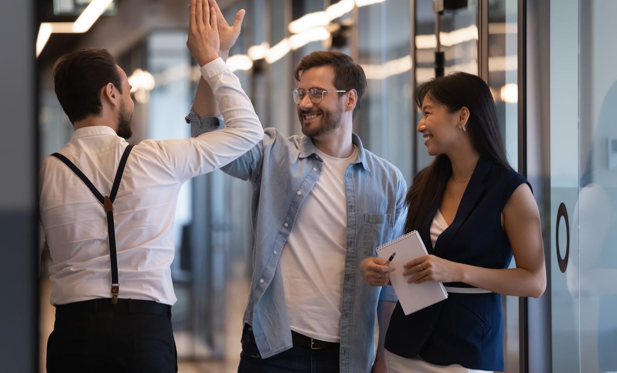 Students giving each other a high five after their Mandarin classes