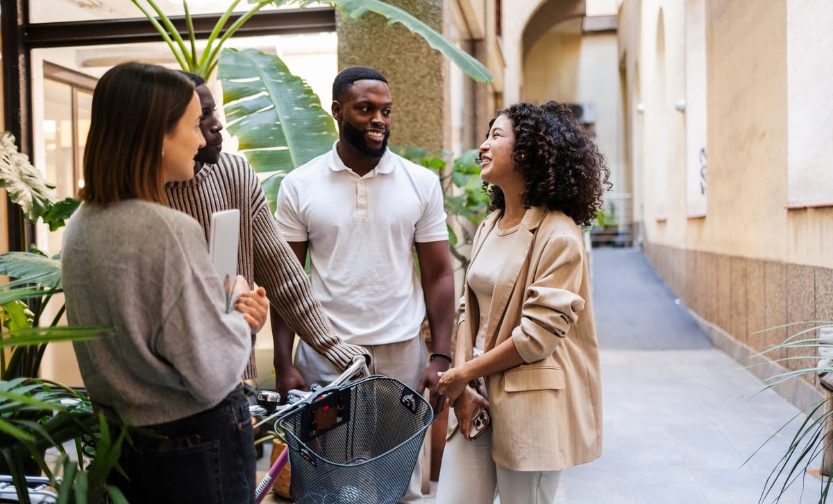 Man chatting with his friends after his Portugese class with Berlitz