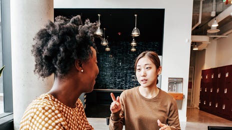 Woman working as a language instructor at Berlitz Czechia and teaching her student a new language