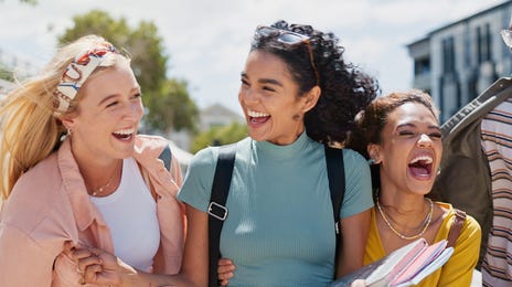 Teens laughing together on their way to their group language lesson with Berlitz Czechia
