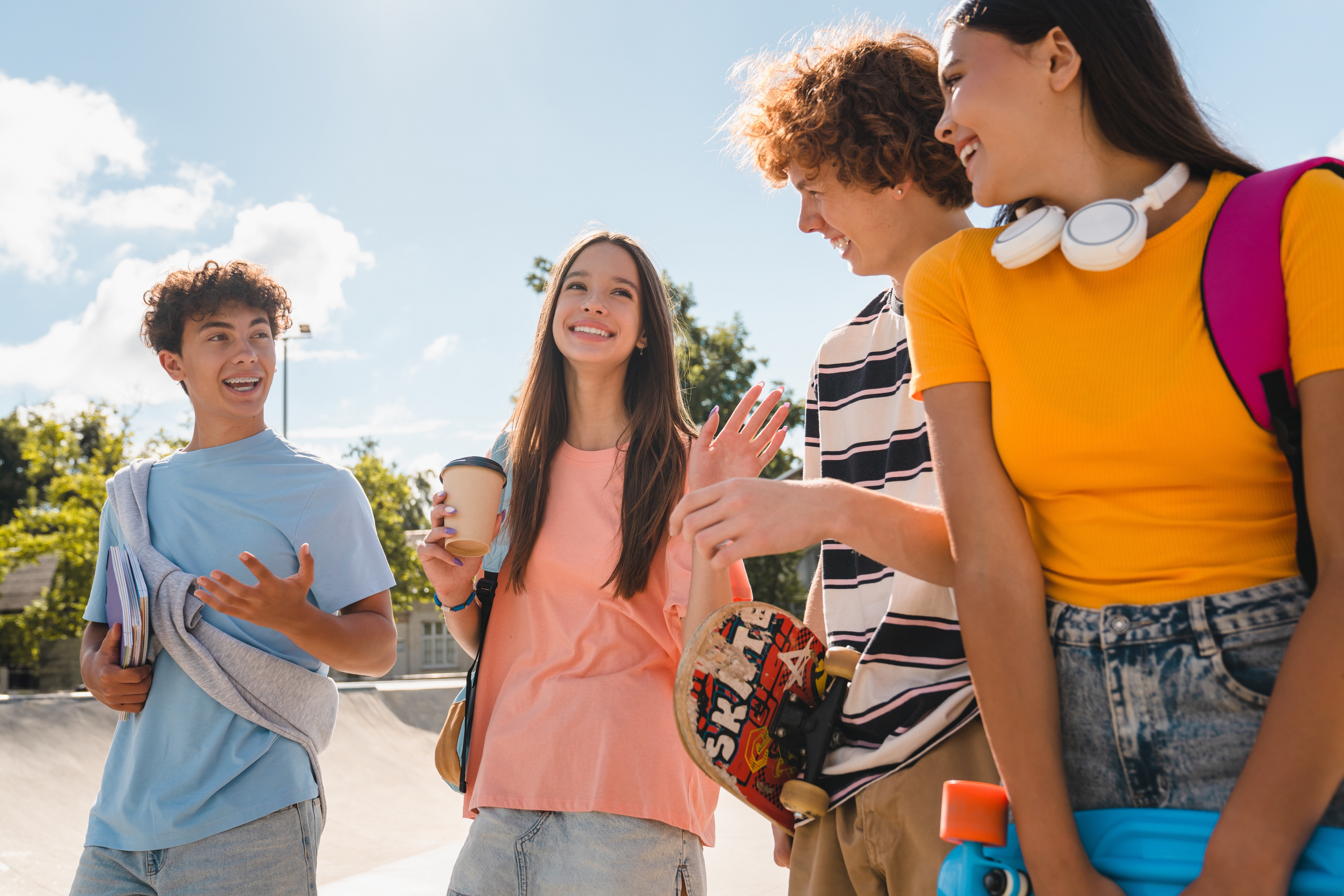 Group of teenagers chatting happily with each other while making their way to their summer program with Berlitz Czechia