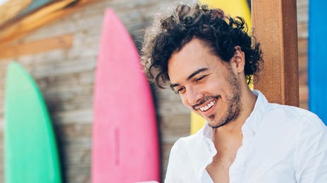 Student with a laptop in his lap learning about the different language course option Berlitz Czechia offers