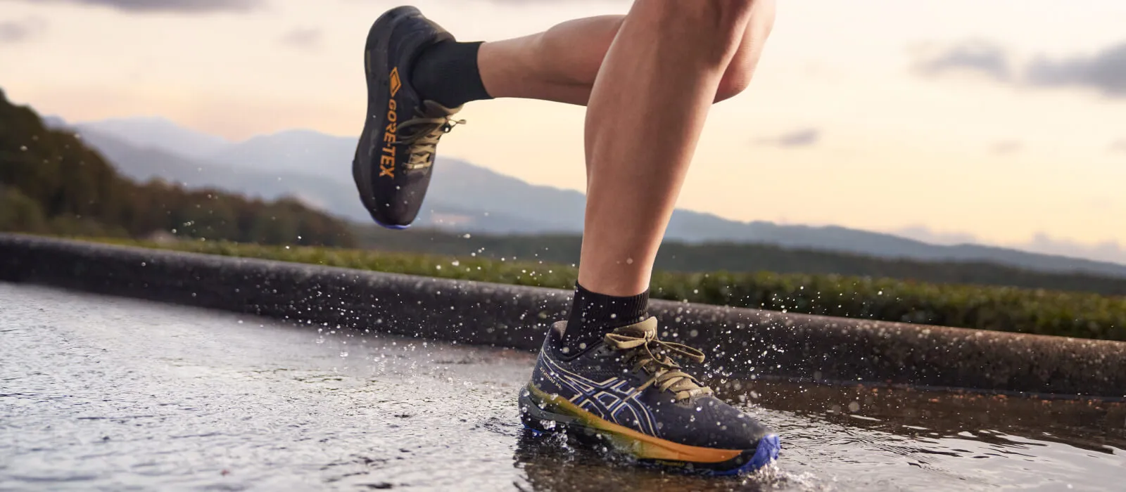 Runner in the rain wearing ASICS Goretex shoes