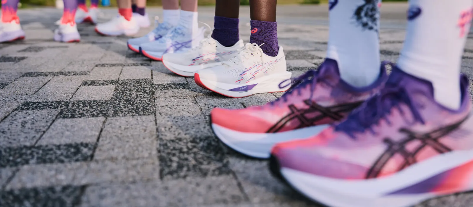 Runners standing outside wearing the ASICS Tokyo Collection
