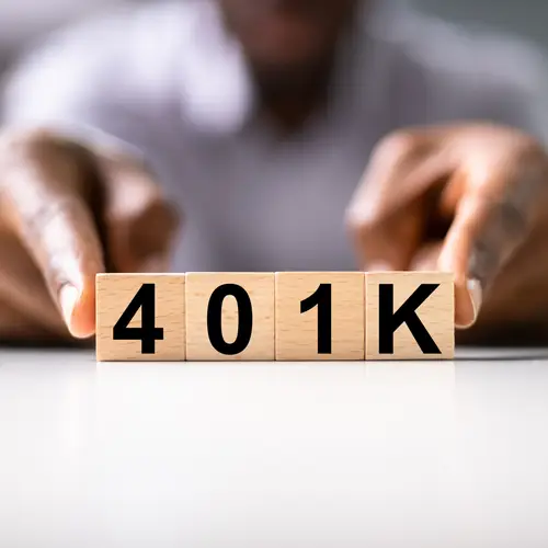 Wooden blocks spelling out 401K