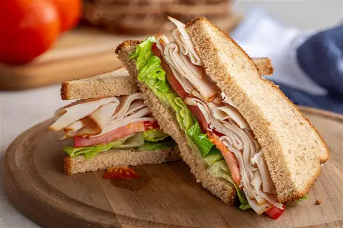 Turkey sandwich with lettuce and tomato