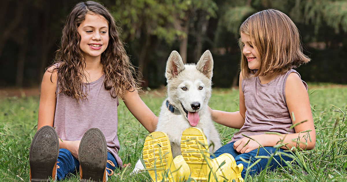 Two girls and a sales dog