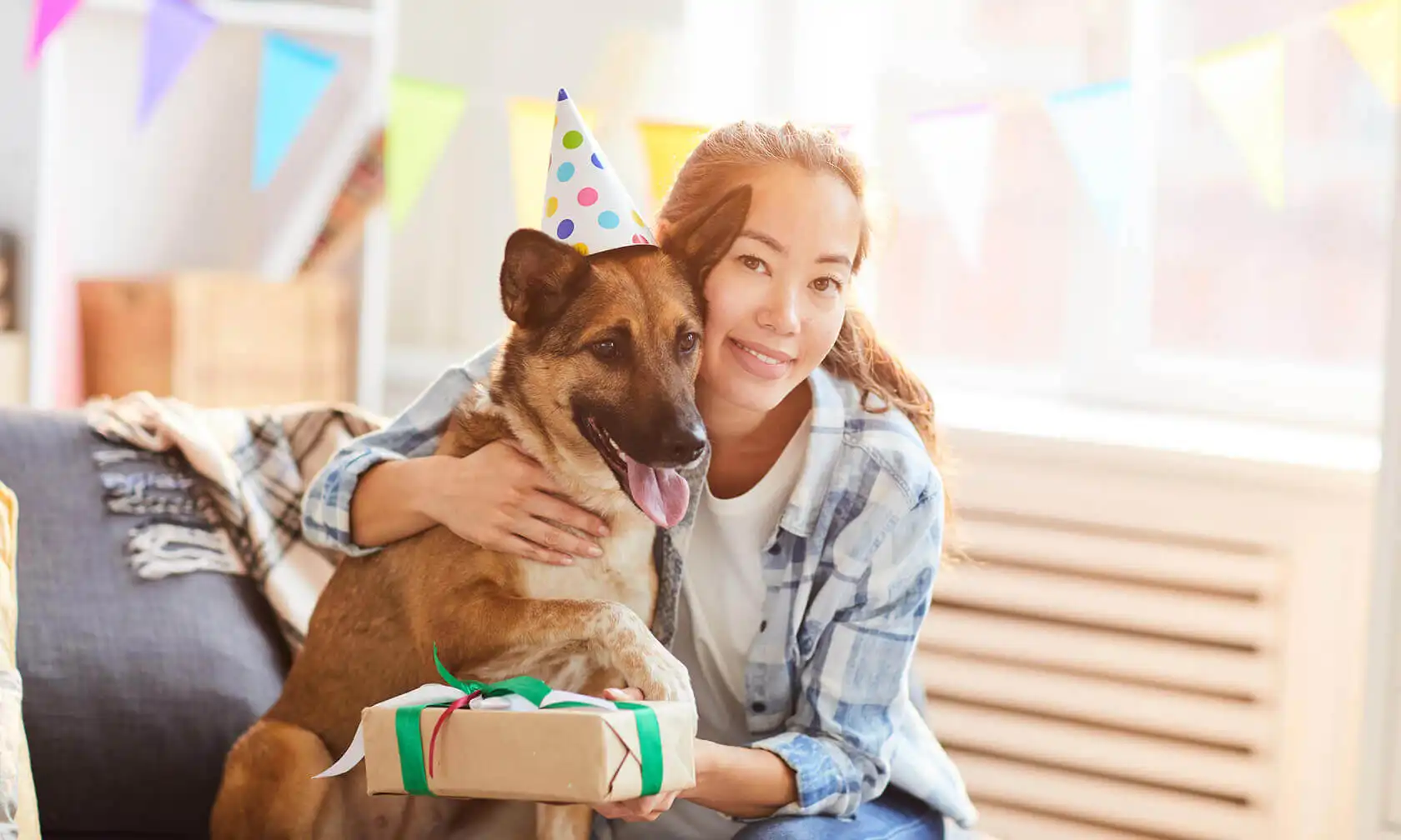 Woman celebrating with her dog.
