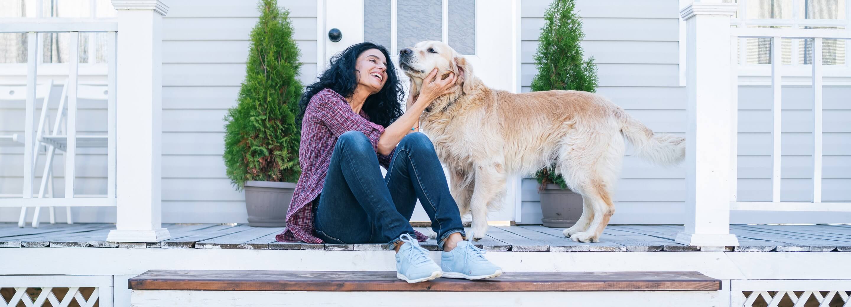 Woman with dog on steps