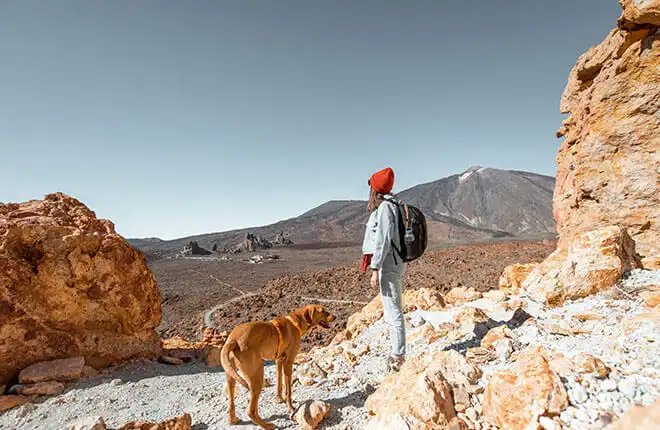 Woman hiking with her dog