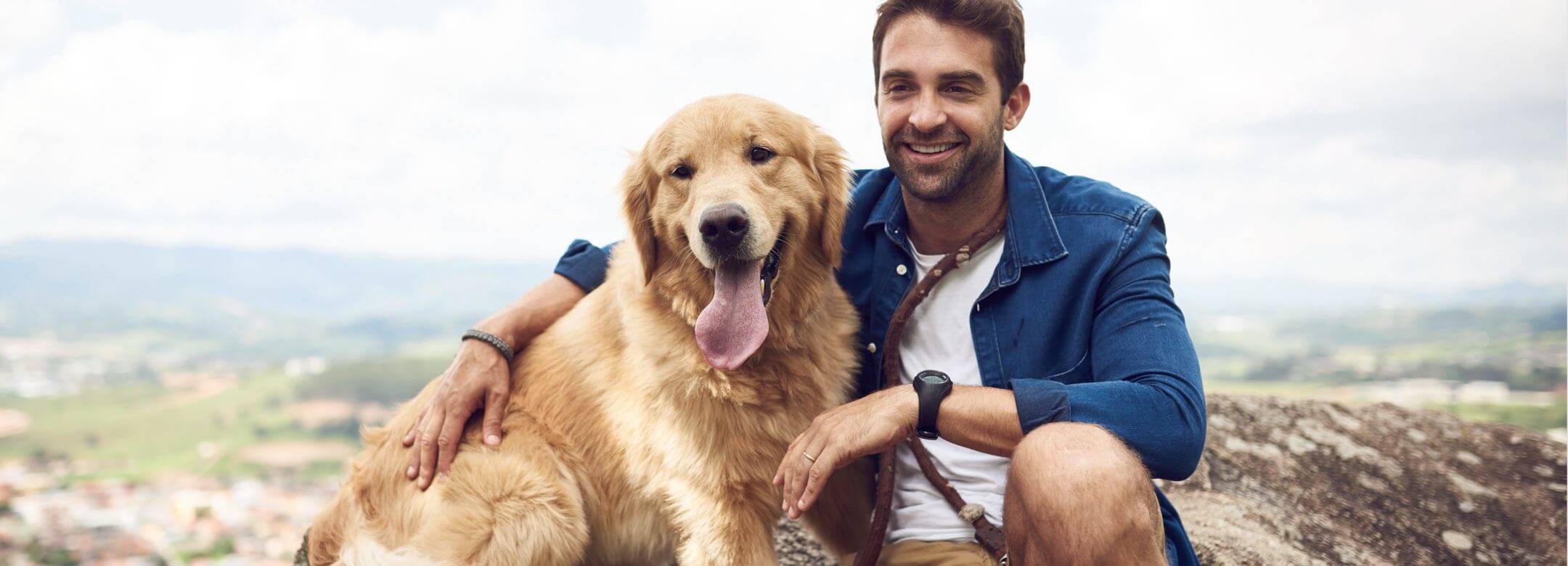 Man and his dog outside.