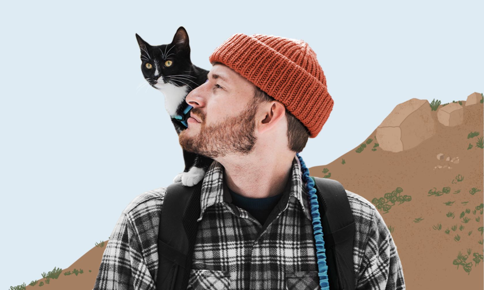 A man with a cat on his shoulders.