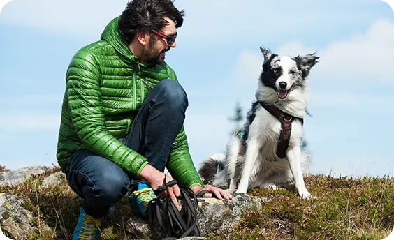 Man sitting with his dog outdoors