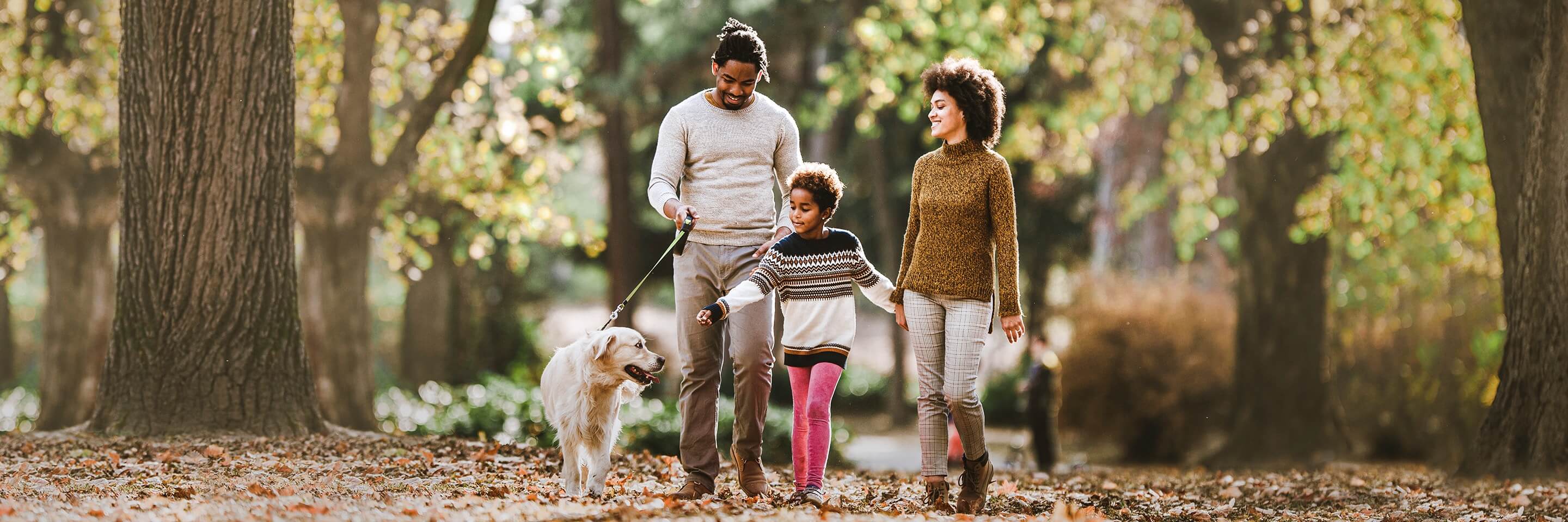 Family with dog in the woods