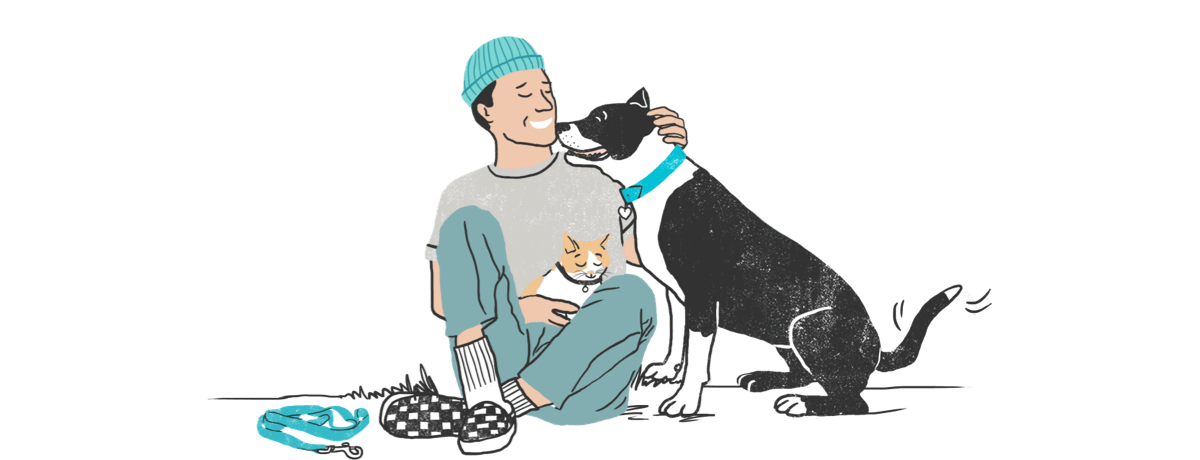 Man sitting with dog and cat